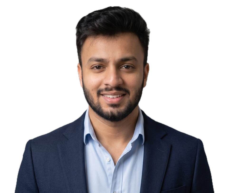 Usama, founder of Remote Bookkeepers, smiling, in a navy blazer and a light blue shirt