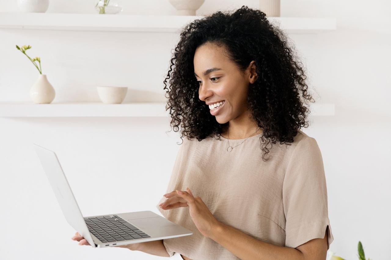 A bookkeeper working remotely on a laptop